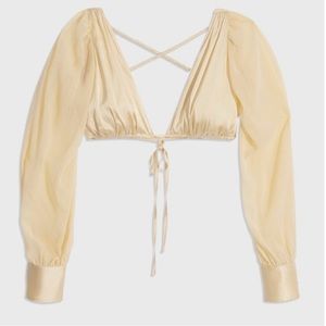 Danielle Bernstein yellow puff sleeve top